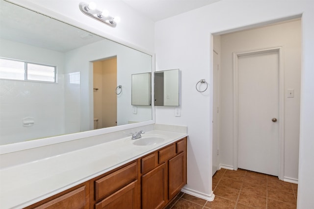 bathroom with vanity and tile patterned floors