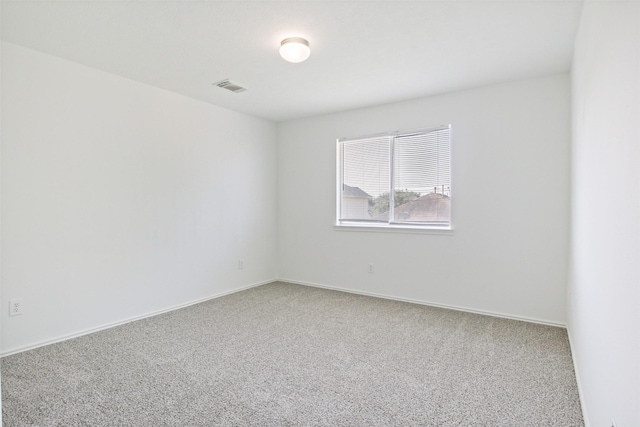 empty room featuring carpet flooring