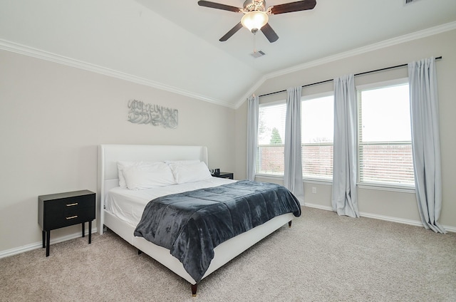 carpeted bedroom with ornamental molding, vaulted ceiling, and multiple windows