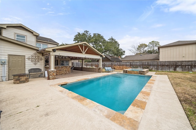 view of swimming pool featuring a gazebo, an in ground hot tub, an outdoor bar, and a patio area