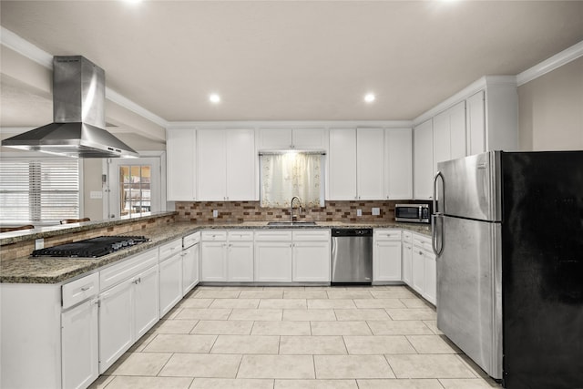 kitchen with white cabinetry, island exhaust hood, appliances with stainless steel finishes, and dark stone countertops