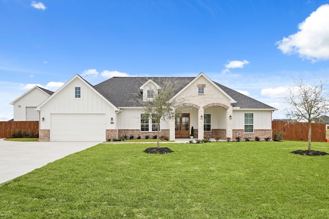 view of front facade featuring a garage and a front yard