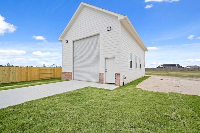 garage featuring a yard