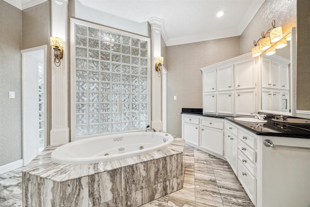 bathroom featuring a relaxing tiled tub, ornamental molding, decorative columns, and vanity