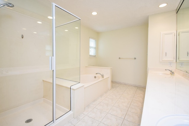 19431 Joanleigh Dr, Spring, TX 77388 - bathroom featuring a garden tub, double vanity, recessed lighting, tile patterned floors, and a shower stall