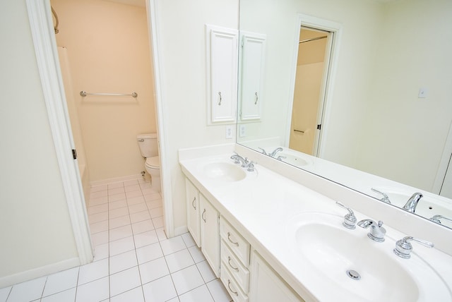 19431 Joanleigh Dr, Spring, TX 77388 - bathroom featuring baseboards, a sink, tile patterned floors, and toilet