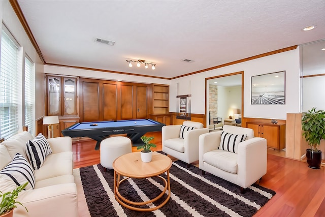19431 Joanleigh Dr, Spring, TX 77388 - living room with crown molding, a wainscoted wall, pool table, wood finished floors, and visible vents