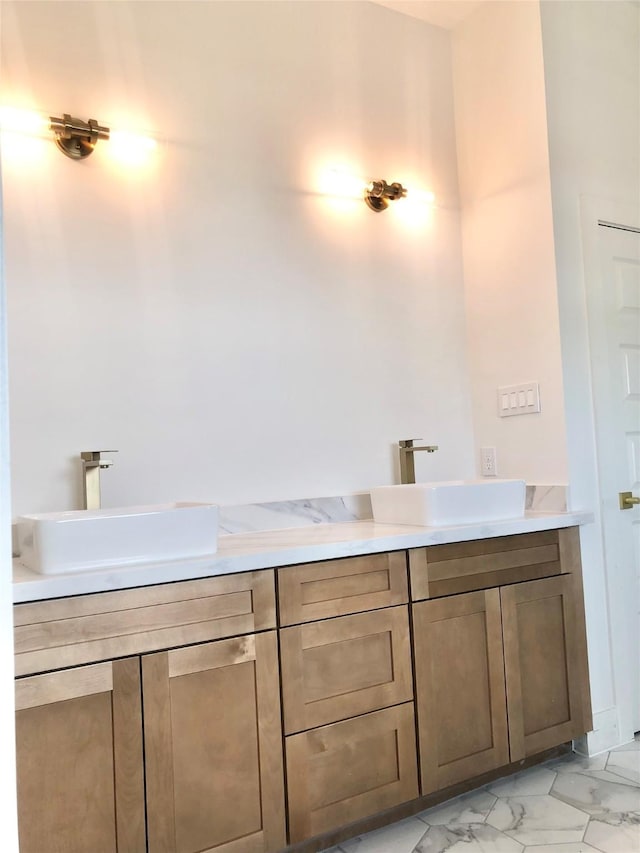 2215 Bevis St, Houston, TX 77008 - bathroom with double vanity and marble finish flooring