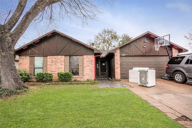 view of front of home featuring a garage and a front lawn