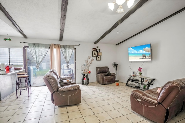 tiled living room with a wealth of natural light, lofted ceiling with beams, and a textured ceiling