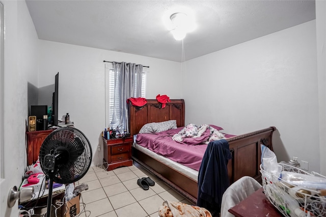 bedroom featuring light tile patterned flooring