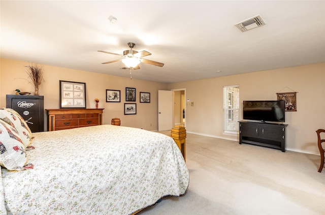 carpeted bedroom featuring visible vents, ceiling fan, and baseboards