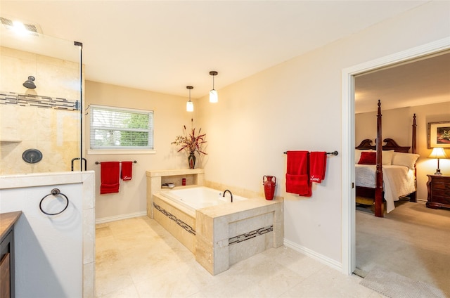 bathroom with ensuite bathroom, a shower stall, a garden tub, and baseboards