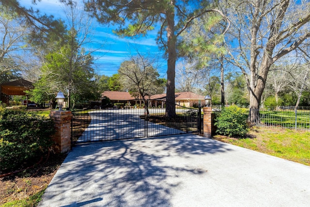 view of gate featuring fence