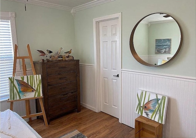 interior space with hardwood / wood-style flooring and ornamental molding