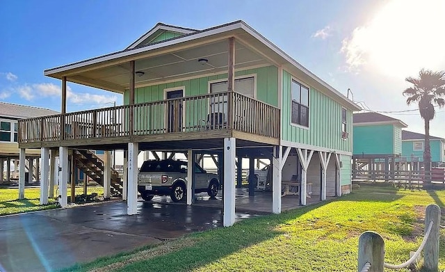 back of property featuring a yard and a carport