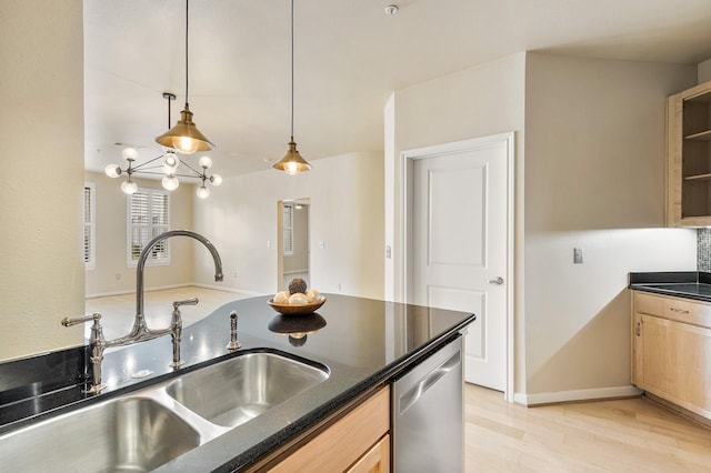 505 Jackson Hill St S Unit 108, Houston, TX 77007 - kitchen featuring a sink, stainless steel dishwasher, light wood finished floors, light brown cabinets, and hanging light fixtures