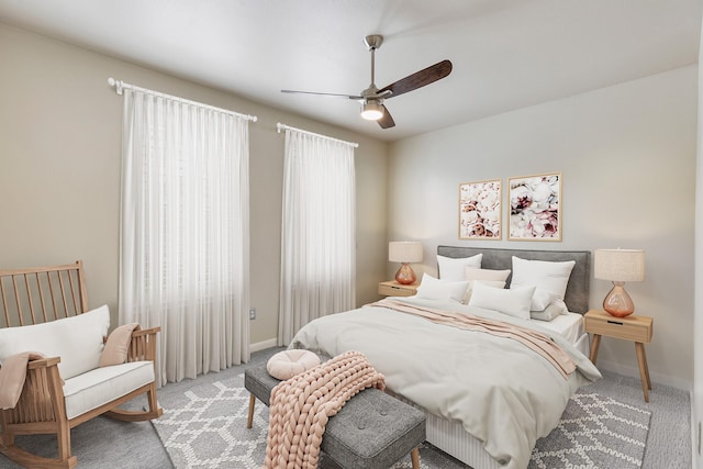 505 Jackson Hill St S Unit 108, Houston, TX 77007 - carpeted bedroom with baseboards and a ceiling fan