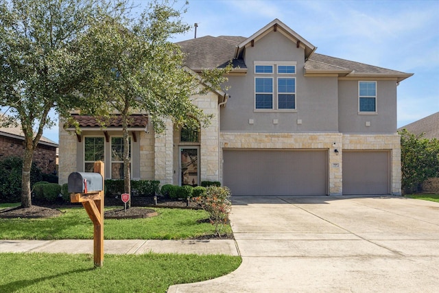 view of front facade with an attached garage, stone siding, driveway, and stucco siding