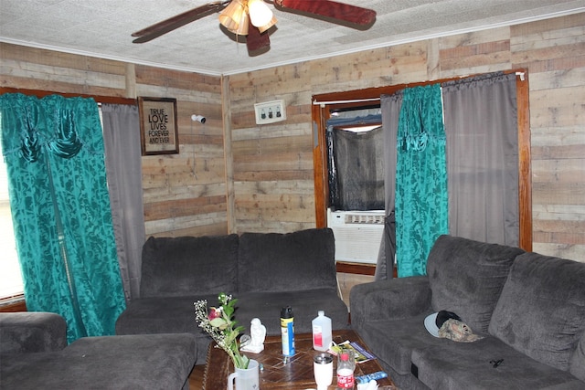 living room featuring ornamental molding, cooling unit, ceiling fan, and wooden walls