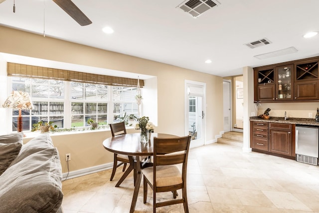 dining space with indoor wet bar