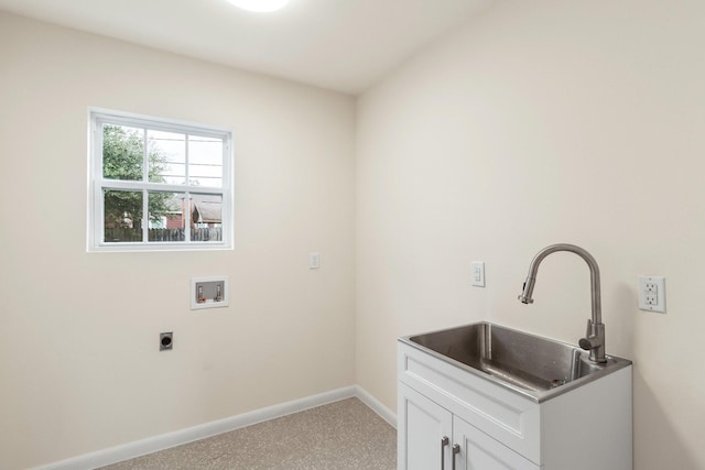 washroom featuring electric dryer hookup, sink, hookup for a washing machine, and cabinets