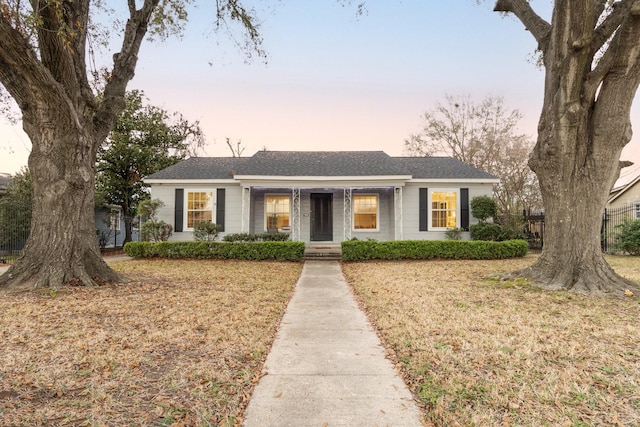 ranch-style house featuring a lawn