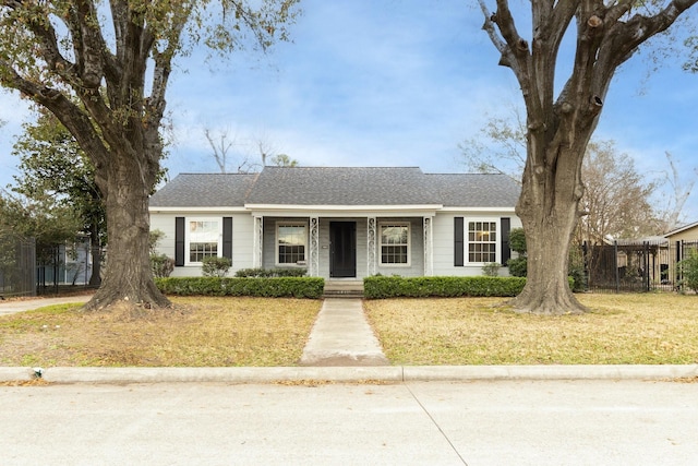 ranch-style home featuring a front yard