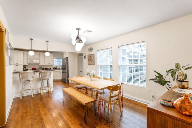 dining space featuring hardwood / wood-style floors