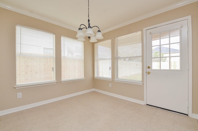 unfurnished dining area with ornamental molding and an inviting chandelier