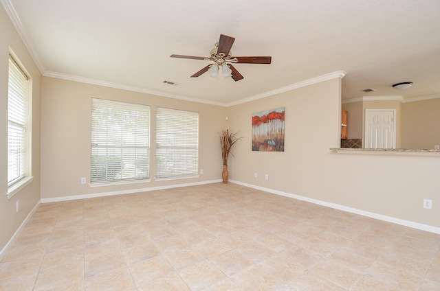 spare room featuring crown molding, a wealth of natural light, and ceiling fan