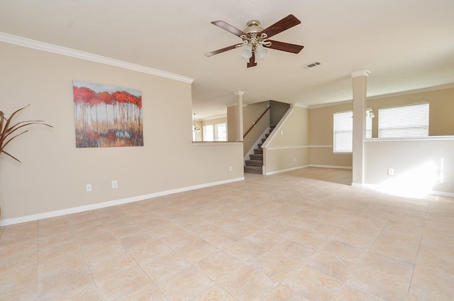 unfurnished room featuring decorative columns, crown molding, and ceiling fan