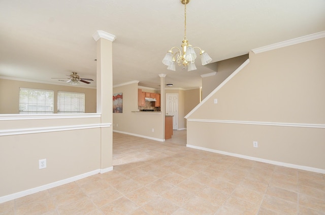 empty room featuring ornate columns, crown molding, and ceiling fan with notable chandelier