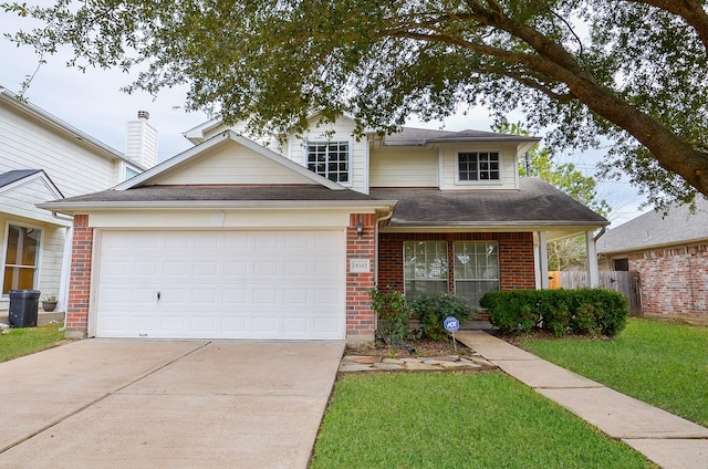 view of front of house with a garage and a front lawn