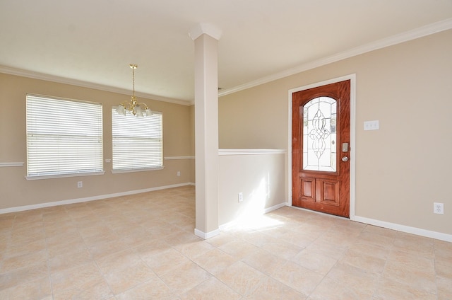 entrance foyer featuring crown molding, a chandelier, and a wealth of natural light