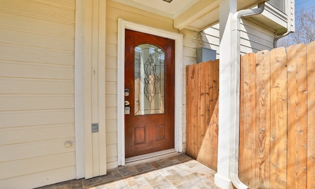 view of exterior entry featuring a garage