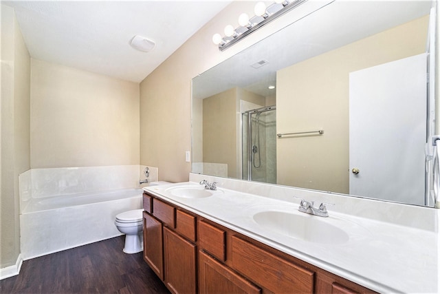 full bathroom featuring a garden tub, visible vents, a sink, and toilet