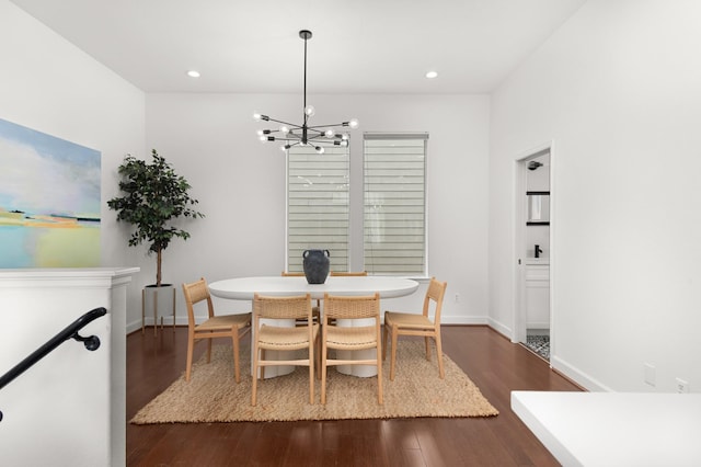 dining room featuring a notable chandelier and dark hardwood / wood-style floors