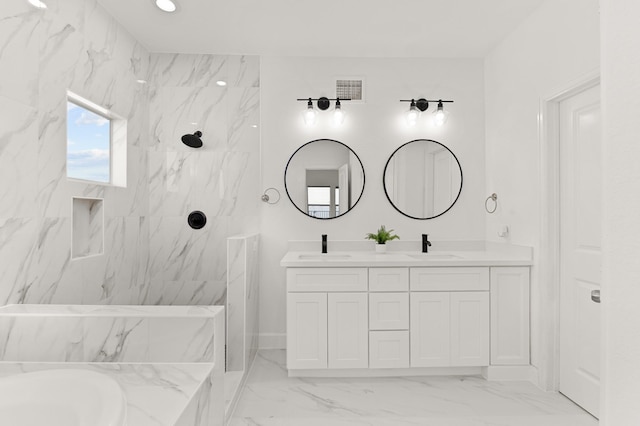 bathroom featuring vanity and separate shower and tub