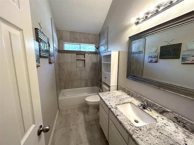 full bathroom featuring tile patterned floors, toilet, lofted ceiling, tiled shower / bath, and vanity