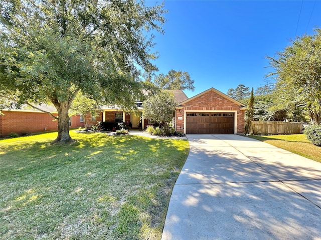 view of front of home with a garage and a front yard