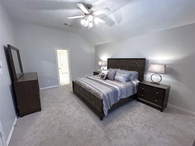 carpeted bedroom with ceiling fan, vaulted ceiling, and a textured ceiling