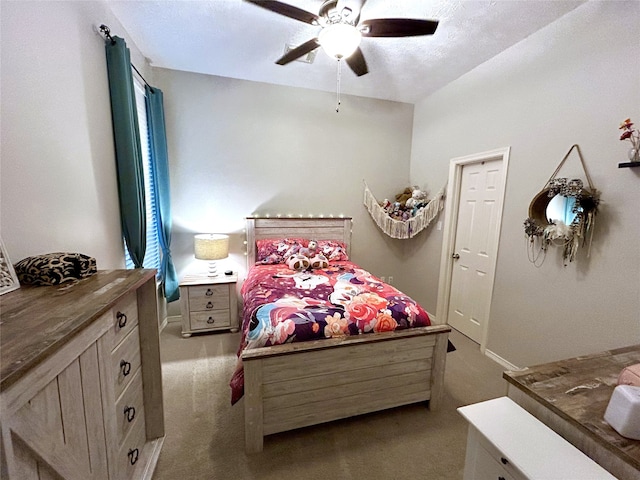 carpeted bedroom with ceiling fan