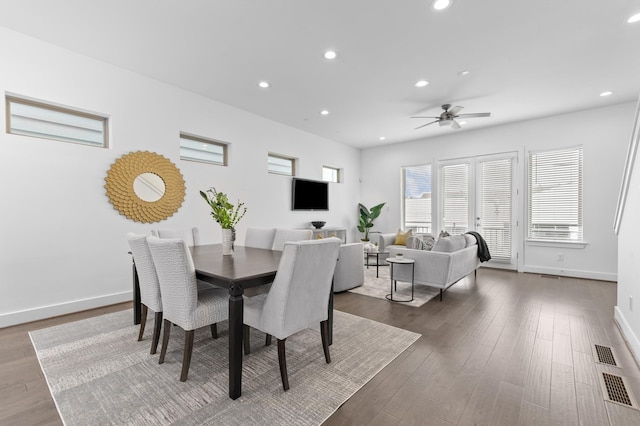 dining room with hardwood / wood-style flooring and ceiling fan