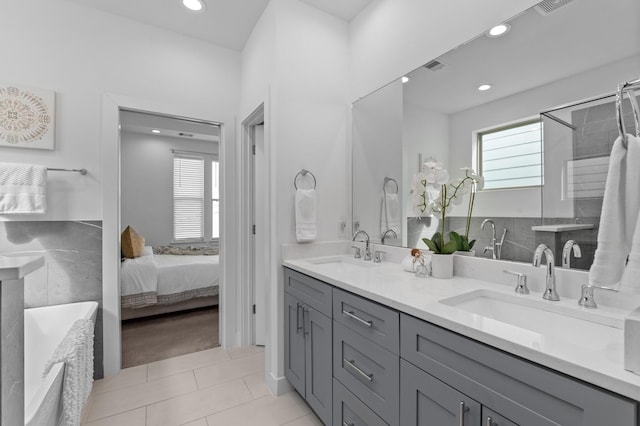 bathroom with vanity and tile patterned flooring