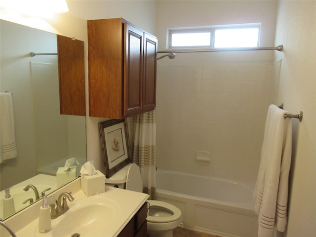 full bathroom with vanity, shower / bath combination with curtain, and toilet