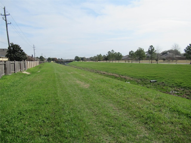 view of yard with a rural view