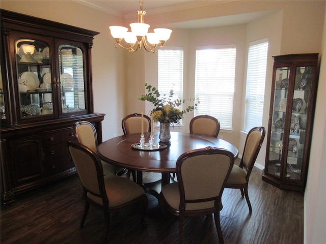 dining room featuring ornamental molding, dark hardwood / wood-style floors, and a notable chandelier