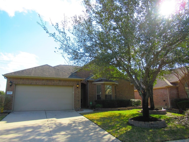 single story home featuring a garage and a front yard