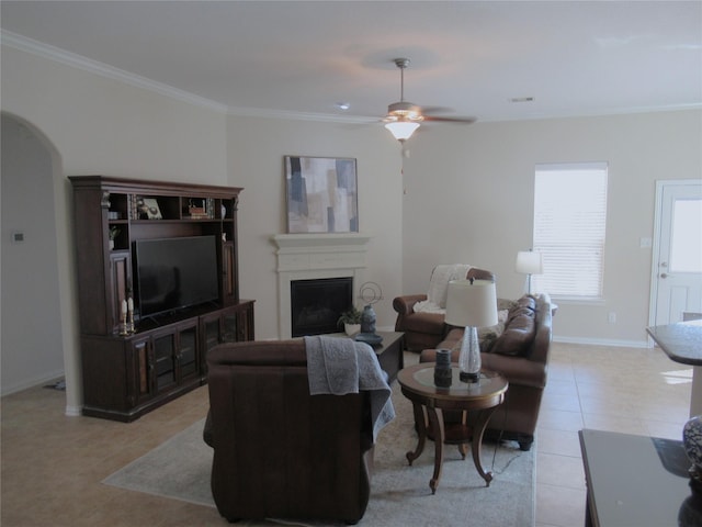 living room featuring ornamental molding, ceiling fan, and light tile patterned flooring